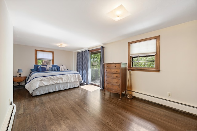 161 Center Hill Rd, Barkhamsted, CT 06063 - bedroom with a baseboard heating unit, baseboard heating, wood finished floors, and multiple windows
