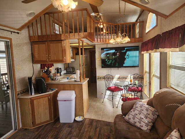 42 Pierce Rd, Preston, CT 06365 - kitchen with a sink, ceiling fan, light countertops, brown cabinets, and ornamental molding