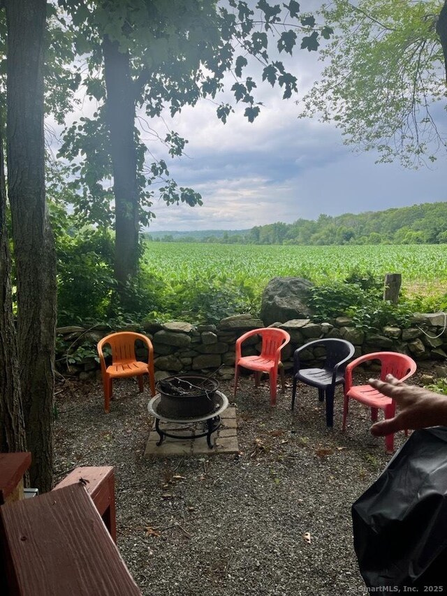 42 Pierce Rd, Preston, CT 06365 - view of yard featuring agricultural area, a fire pit, and a view of rural / pastoral area