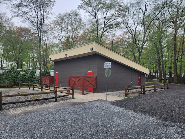 42 Pierce Rd, Preston, CT 06365 - view of side of home featuring concrete block siding and fence