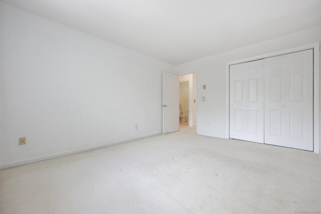 97 Richards Ave Apt F5, Norwalk, CT 06854 - unfurnished bedroom featuring carpet floors, baseboards, and a closet
