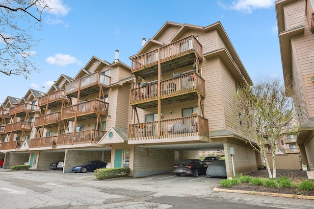 97 Richards Ave Apt F5, Norwalk, CT 06854 - view of building exterior featuring covered parking