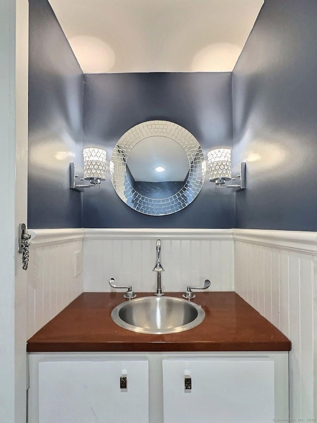 bathroom with wainscoting and vanity