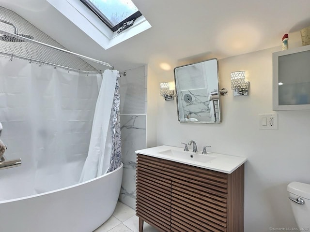full bathroom with a skylight, toilet, shower / bath combo, vaulted ceiling, and vanity