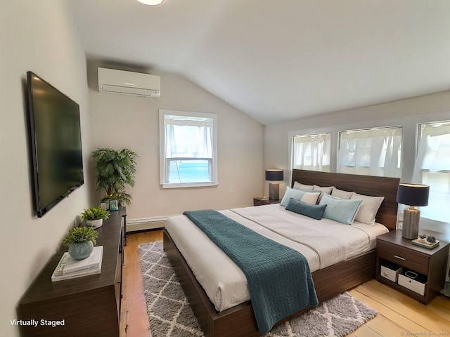 bedroom with a wall unit AC, vaulted ceiling, a baseboard heating unit, and light wood-type flooring