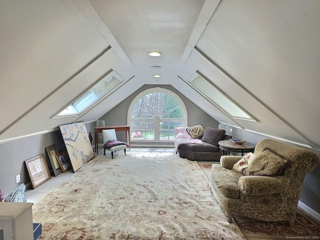additional living space featuring a skylight, lofted ceiling, and carpet