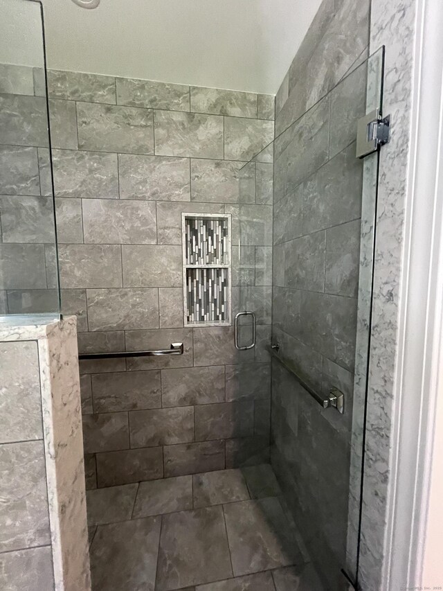 bathroom featuring a shower stall