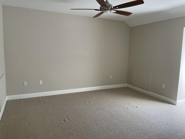 unfurnished room with baseboards, ceiling fan, and light carpet