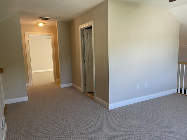 interior space with visible vents, carpet flooring, and baseboards