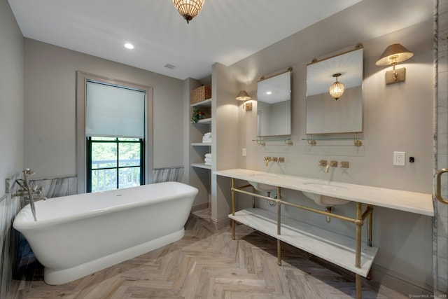 175 Lake Ave, Greenwich, CT 06830 - full bathroom with a freestanding bath, double vanity, baseboards, and recessed lighting