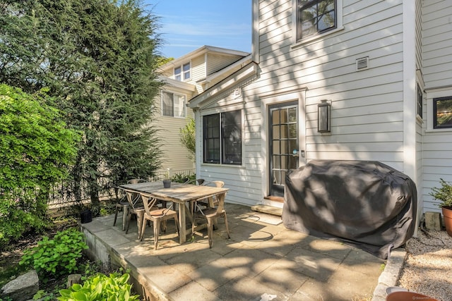 view of patio / terrace featuring outdoor dining space, grilling area, and entry steps