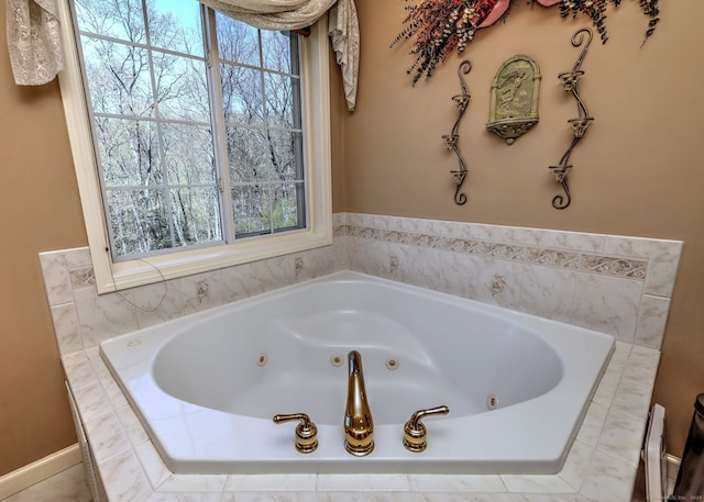 full bathroom with a whirlpool tub