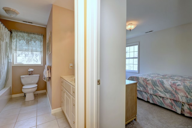 bedroom featuring visible vents, baseboards, and light tile patterned floors