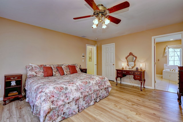 bedroom featuring baseboards, visible vents, and light wood-type flooring