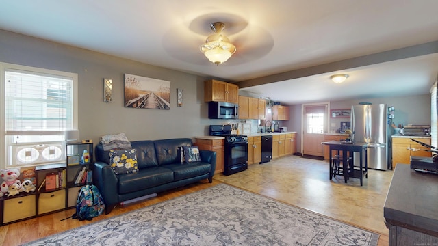 living room with a ceiling fan