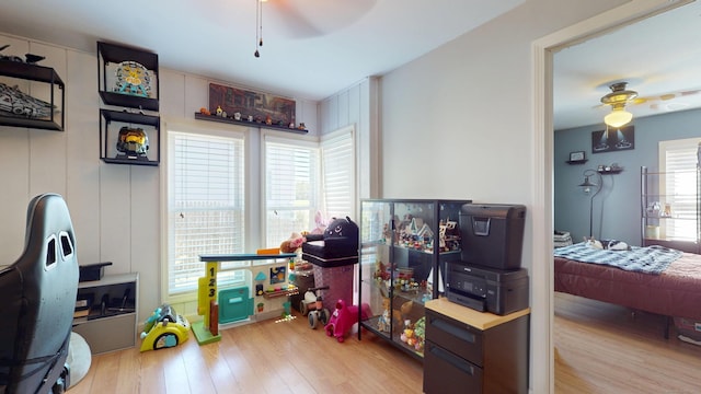rec room featuring ceiling fan and wood finished floors