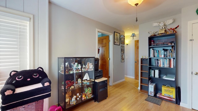 misc room with light wood finished floors and baseboards