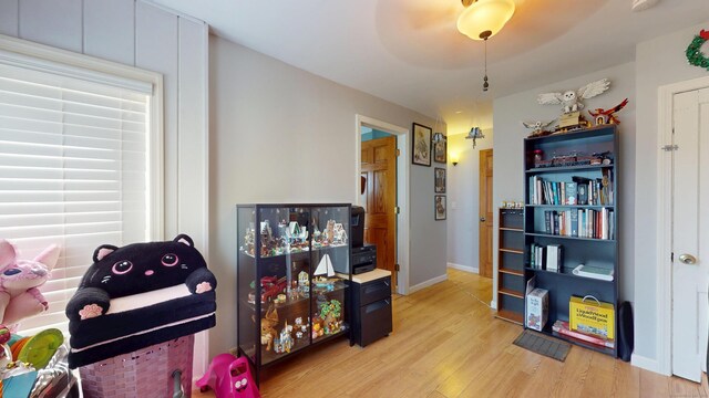 playroom featuring light wood-style flooring and baseboards