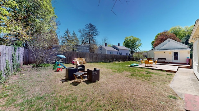 view of yard featuring a wooden deck and outdoor lounge area