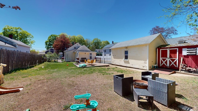 view of yard with a storage shed and an outdoor structure
