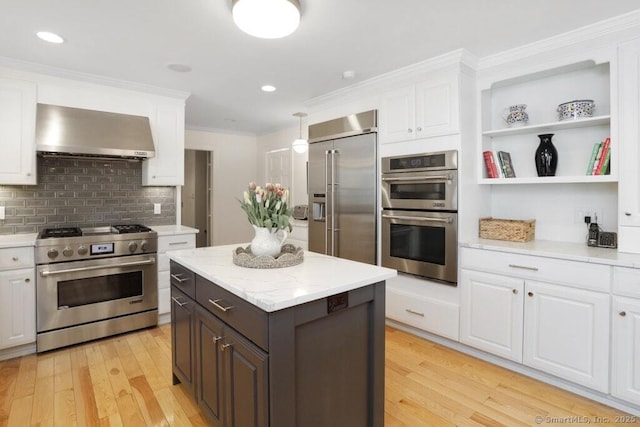 81 Silver Hill Rd, Ridgefield, CT 06877 - kitchen featuring wall chimney range hood, high end appliances, white cabinets, and light wood finished floors