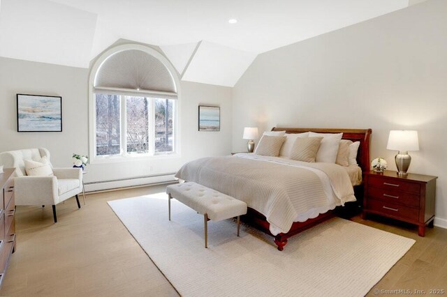81 Silver Hill Rd, Ridgefield, CT 06877 - bedroom featuring a baseboard radiator, light wood-style flooring, and vaulted ceiling