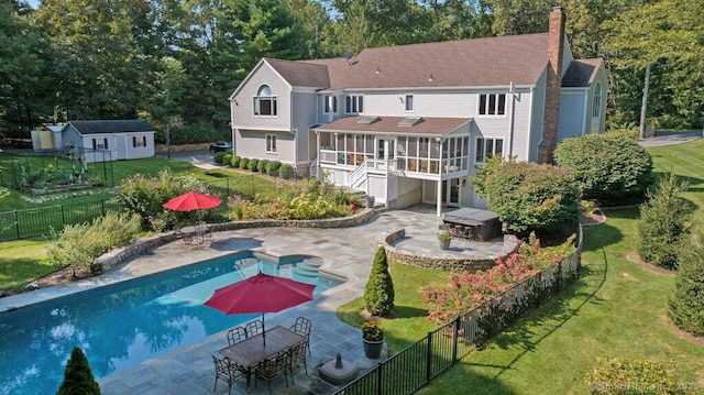 81 Silver Hill Rd, Ridgefield, CT 06877 - rear view of property featuring a fenced backyard, a chimney, a fenced in pool, a patio area, and a yard
