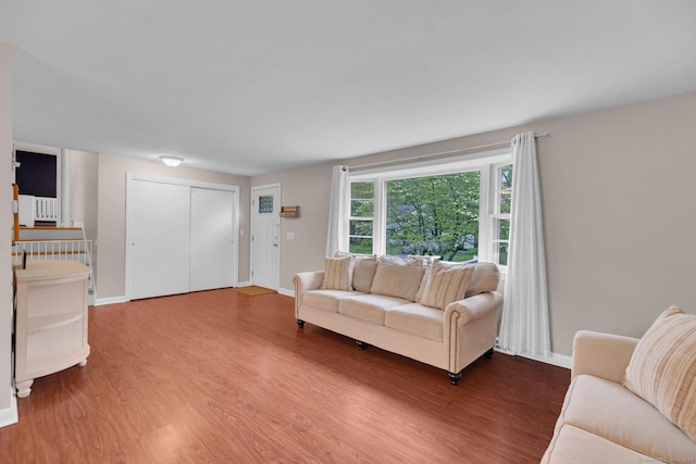 living room with wood finished floors and baseboards
