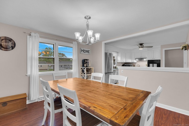 dining area with a chandelier, dark wood finished floors, ceiling fan, and baseboards