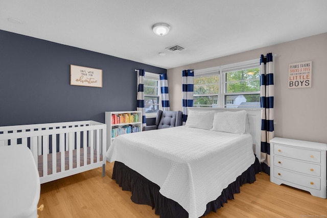 bedroom with wood finished floors