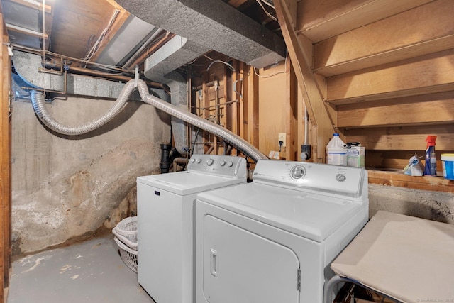 laundry area featuring washing machine and clothes dryer