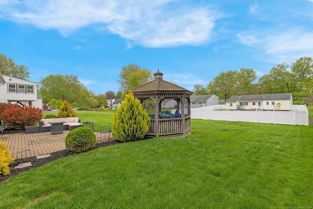 view of yard with outdoor lounge area, a gazebo, and a patio area