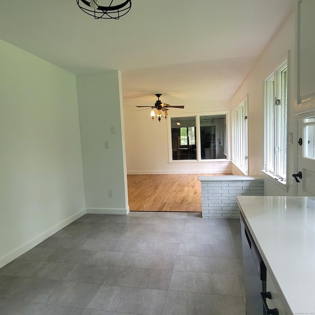 1848 Waterbury Rd, Cheshire, CT 06410 - unfurnished dining area featuring ceiling fan, baseboards, and tile patterned floors