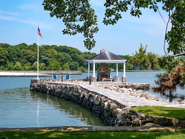 view of dock featuring a gazebo and a water view