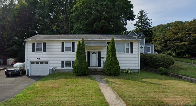 456 Main St, West Haven, CT 06516 - view of front facade featuring asphalt driveway, an attached garage, and a front yard