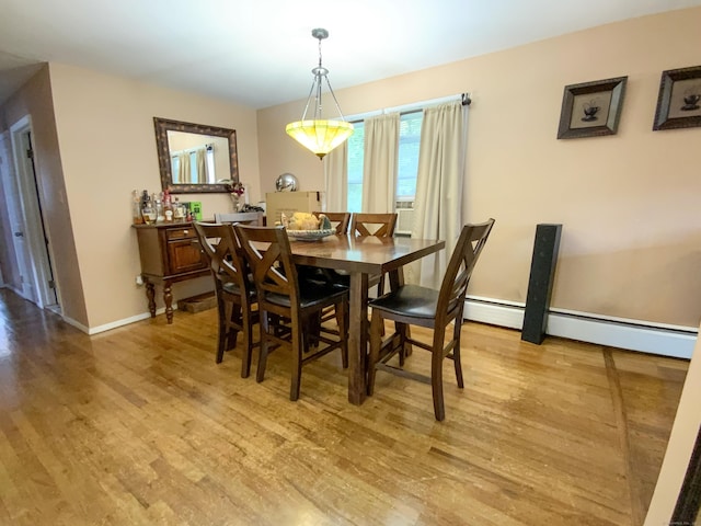 456 Main St, West Haven, CT 06516 - dining room with light wood finished floors, baseboards, and a baseboard radiator