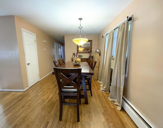 456 Main St, West Haven, CT 06516 - dining space featuring baseboard heating, light wood finished floors, and baseboards