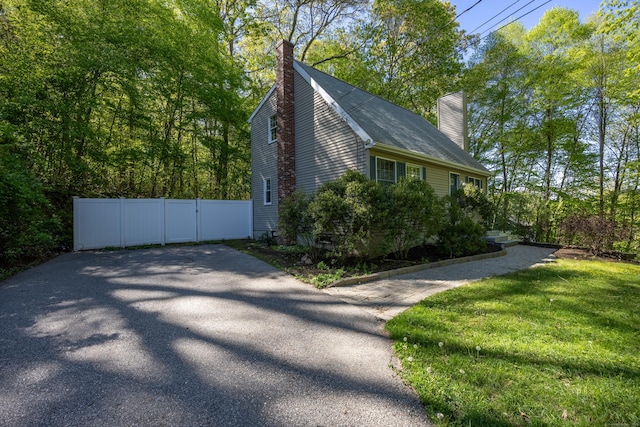 1343 Baldwin Hill Rd, Ledyard, CT 06335 - view of side of home with a chimney and a gate