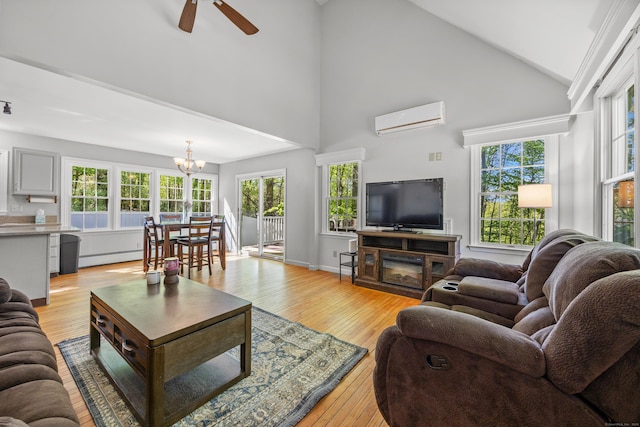 1343 Baldwin Hill Rd, Ledyard, CT 06335 - living room with a wall mounted AC, a baseboard radiator, a ceiling fan, light wood-style floors, and high vaulted ceiling