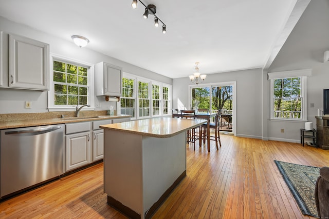 1343 Baldwin Hill Rd, Ledyard, CT 06335 - kitchen featuring stainless steel dishwasher, a sink, a chandelier, light wood-style floors, and a kitchen island