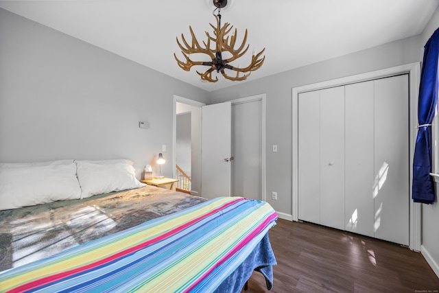 1343 Baldwin Hill Rd, Ledyard, CT 06335 - bedroom with wood finished floors, baseboards, and a chandelier