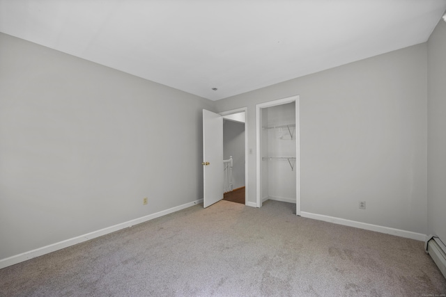 1343 Baldwin Hill Rd, Ledyard, CT 06335 - unfurnished bedroom featuring carpet, baseboards, a closet, and a baseboard heating unit
