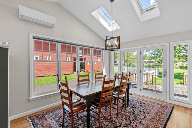 309 N Grand St, Suffield, CT 06093 - sunroom featuring french doors, a wall mounted air conditioner, lofted ceiling, and plenty of natural light