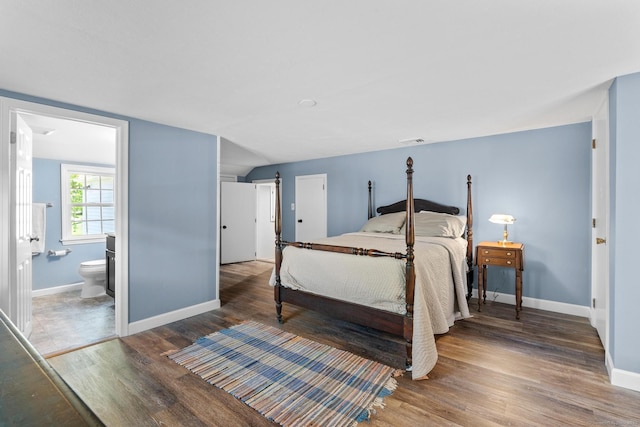 309 N Grand St, Suffield, CT 06093 - bedroom with wood finished floors, baseboards, and connected bathroom