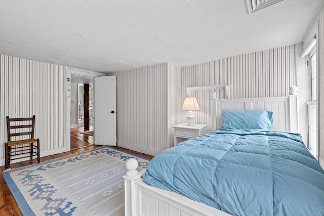 309 N Grand St, Suffield, CT 06093 - bedroom featuring wallpapered walls, wood finished floors, and baseboards