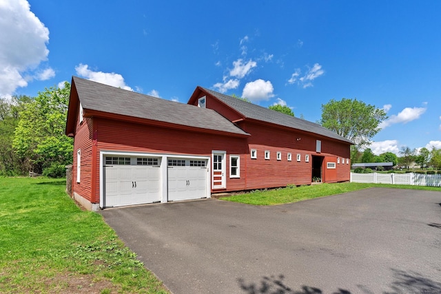 309 N Grand St, Suffield, CT 06093 - view of home's exterior with asphalt driveway and an attached garage