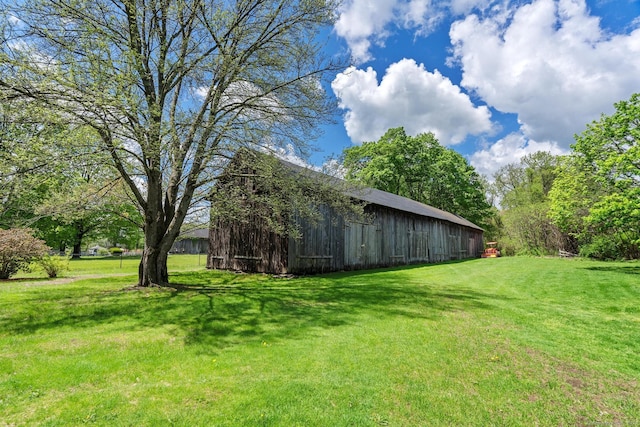 309 N Grand St, Suffield, CT 06093 - view of grassy yard featuring an outdoor structure and a barn
