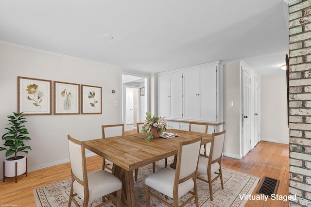 309 N Grand St, Suffield, CT 06093 - dining room featuring light wood-style floors, baseboards, and ornamental molding