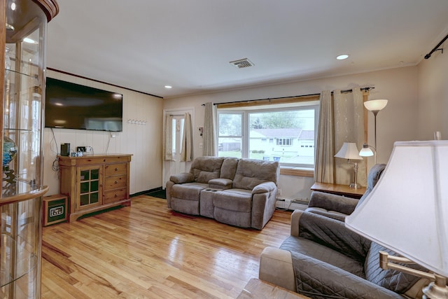 27 Aircraft Rd, West Haven, CT 06516 - living room with wood finished floors, baseboard heating, crown molding, and recessed lighting