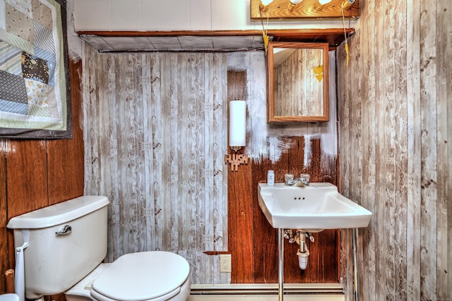 27 Aircraft Rd, West Haven, CT 06516 - bathroom with wood walls, toilet, and a sink
